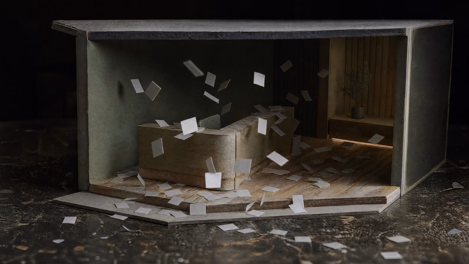 A cutaway model of a modern clinic reception after hours, unlit, with hundreds of blank white cards drifting down through the dark and settling across the desk and the floor.
